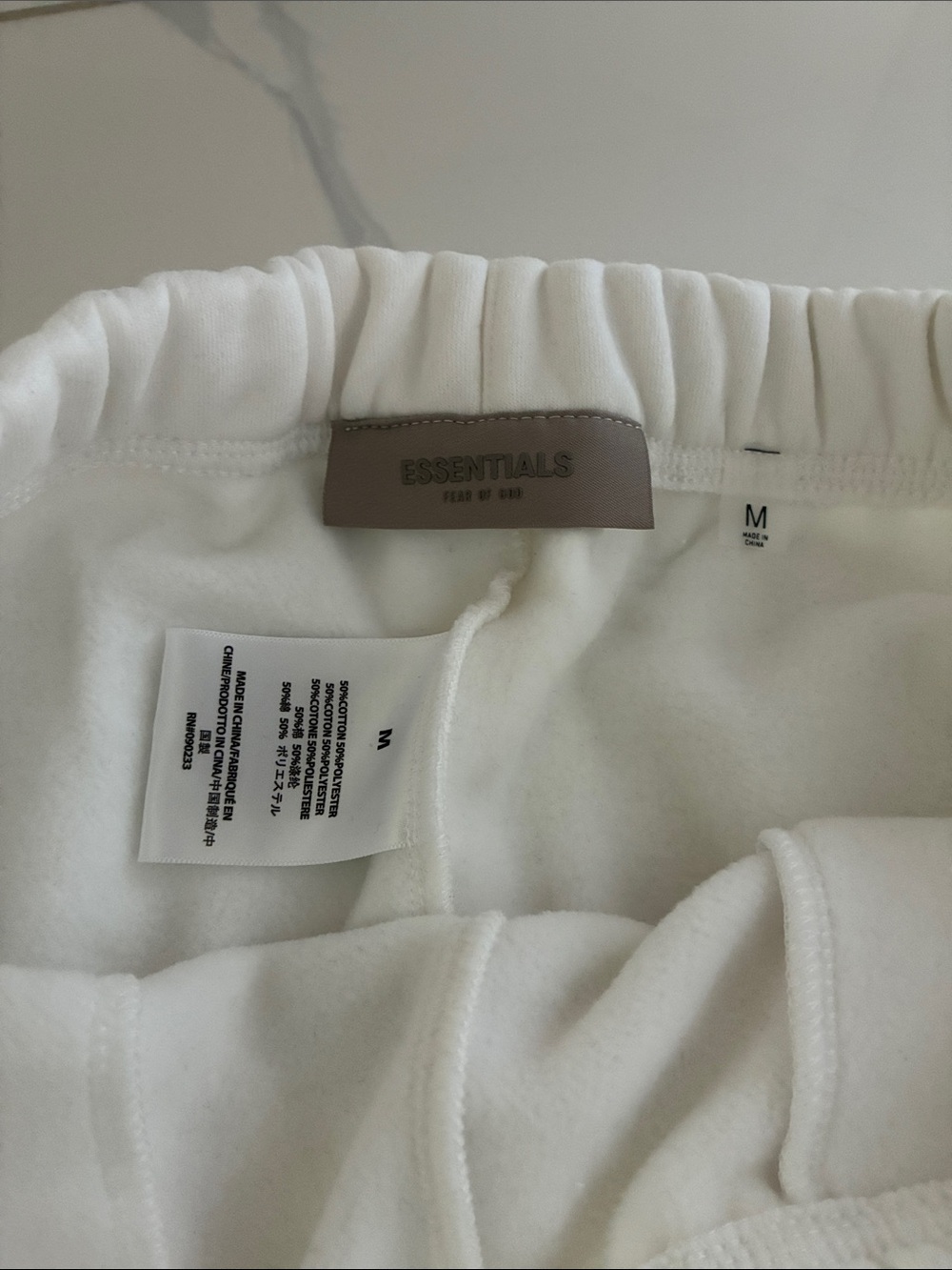 Essentials Men’s White Logo Athletic Shorts - Picture 3 of 3